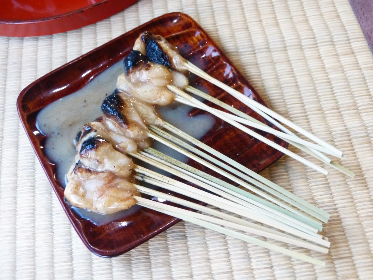 Skewers of grilled aburi mochi coated in white miso sauce