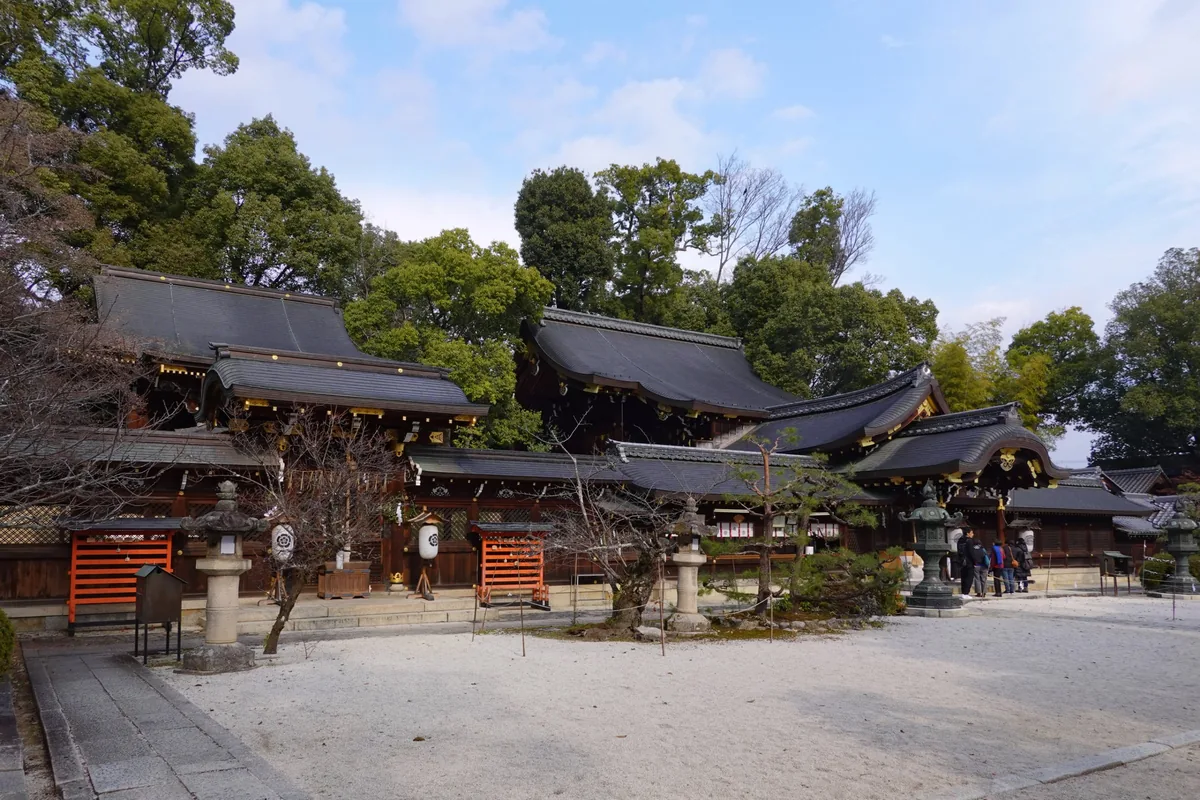 White gravel courtyard and dark-roofed halls of Imamiya Shrine